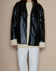Faux leather blazer. faux leather jacket. Single breast. Collar neckline. Front button down closure. Side pockets. Back slit. Fully lined. black leather jacket. black leather blazer. fall jacket. trendy fall jacket. winter jacket. trendy winter jacket