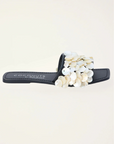 Natural shell-embellished slide sandals
Flat sole
Square toe
Delicate stitching detail