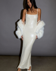 white Sequin knit maxi dress. cream Sequin knit maxi dress. Adjustable straps. Side hook and eye and zipper closures. Fully lined. holiday look. holiday outfit. christmas outfit. new years outfit