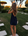 navy blue Halter mini dress
Adjustable neck tie
Side pockets
Lined