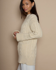 Cable knit sweater dress. Crewneck. Long cuffed sleeves. Unlined. beige sweater dress. fall sweater dress. holiday look