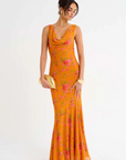 orange Floral printed maxi dress
Cowl neck
Open back with cowl
Adjustable ties at lower back for waist snatching
Mermaid hem
wedding guest dress