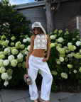 white Open crochet knit halter top
Adjustable neck and back tie
Unlined/Sheer