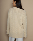 Cable knit sweater dress. Crewneck. Long cuffed sleeves. Unlined. beige sweater dress. fall sweater dress. holiday look