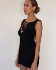 black Sleeveless knit dress
Pictured worn both ways
Fixed straps
Open back
Elastic sides and back waistband
Unlined