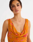 orange Floral printed maxi dress
Cowl neck
Open back with cowl
Adjustable ties at lower back for waist snatching
Mermaid hem
wedding guest dress