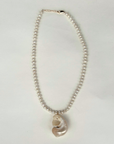 Freshwater pearls with pearlized shell charm necklace
Length: 15" chain with 1" extender
Size and shape of pearl may vary