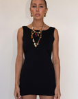 black Sleeveless knit dress
Pictured worn both ways
Fixed straps
Open back
Elastic sides and back waistband
Unlined
