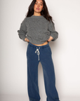 Knit sweatpants. Elastic waistband with drawstring closure. Side pockets. Unlined. blue denim sweatpants. cute loungewear.