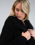Black Faux sherpa longline coat. Faux fur collar neckline. Front snap button closure. Tie waist. Side pockets. Back slit. Fully lined. long coat. coat for new york. fall coat. fall outfit