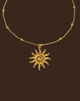 Gold necklace with a sun-shaped pendant necklace
18K Gold Non-Tarnish Boho Sun Necklace
18K Gold Plated
Stainless Steel
Pendant Size: 1.5" / Chain Length: 15.57" / Extension Length: 2"
Lead-free
Nickel-safe
Hypoallergenic
Water Resistant