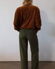Woven utility pants. Button fly. Four pocket construction. Unlined. green pants. fall outfit.