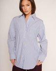 blue and white Striped oversized button down shirt
Collared
Front chest pocket
Long sleeve
Button down closure
Unlined