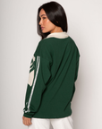 Graphic printed knit top. Collar neckline. Long sleeves. Unlined. green graphic long sleeve tee. bonjour tee