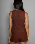 Houndstooth woven sleeveless top. Front button down closure. Front pockets. Fully lined. plaid vest top. plaid skirt set. fall outfit. winter outfit.
