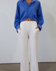 Ribbed knit pants. Elastic waistband. Side pockets. Unlined. causal pant. fall pant. cream casual pant