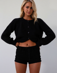 Fuzzy black crochet knit cardigan. Front button down closure. black sweater cardigan. fall outfit. fall transition