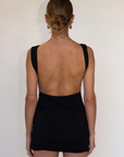 black Sleeveless knit dress
Pictured worn both ways
Fixed straps
Open back
Elastic sides and back waistband
Unlined