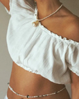Freshwater pearls with pearlized shell charm necklace
Length: 15" chain with 1" extender
Size and shape of pearl may vary