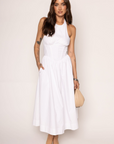Woven midi dress
Adjustable halter neckline
Boning in bodice
Side pockets
Elastic back neckline
Back hook and eye and zipper closures
Fully lined
white midi dress
bridal dress
bridal shower dress