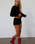 Fuzzy black crochet knit cardigan. Front button down closure. black sweater cardigan. fall outfit. fall transition