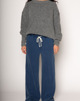 Knit sweatpants. Elastic waistband with drawstring closure. Side pockets. Unlined. blue denim sweatpants. cute loungewear.