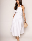 Woven midi dress
Adjustable halter neckline
Boning in bodice
Side pockets
Elastic back neckline
Back hook and eye and zipper closures
Fully lined
white midi dress
bridal dress
bridal shower dress