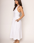 Woven midi dress
Adjustable halter neckline
Boning in bodice
Side pockets
Elastic back neckline
Back hook and eye and zipper closures
Fully lined
white midi dress
bridal dress
bridal shower dress