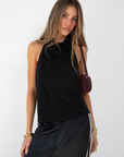 black Halter neck top
Low back
Neck button closure
Partially lined