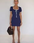 blue Short sleeve mini dress
Front and sleeve tie
Hook eye front closure
Contrast trim stitching
Back smocking
Side zipper
Lined
summer mini dress
spring mini dress