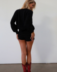 Fuzzy black crochet knit cardigan. Front button down closure. black sweater cardigan. fall outfit. fall transition