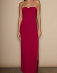Knit maxi dress. Strapless neckline. Ruched front. Side slit. Partially lined. red strapless maxi dress. holiday maxi dress. holiday look.