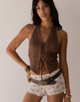 brown Suede halter top
Stud detailing
Front lace up
Fixed neck strap
Open back
Unlined
Length: 21"
Polyester/Spandex
stagecoach outfit
coachella outfit