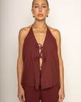 brown Relaxed style halter top
Adjustable halter neck tie
Front and back tie closures
Fully lined