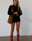 Fuzzy black crochet knit cardigan. Front button down closure. black sweater cardigan. fall outfit. fall transition