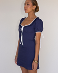 blue Short sleeve mini dress
Front and sleeve tie
Hook eye front closure
Contrast trim stitching
Back smocking
Side zipper
Lined
summer mini dress
spring mini dress