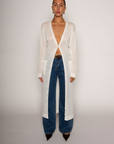 white Thin knit longline cardigan
Long sleeves
Front button down closure
Front pockets
Side slits
Unlined
pool cover up
beach cover up
