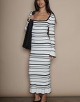 Faux fur striped ribbed knit maxi dress. Square neckline. Long sleeves. Unlined. fuzzy maxi dress. holiday look. holiday dress. white and black stripe dress