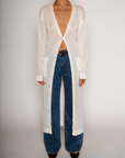 white Thin knit longline cardigan
Long sleeves
Front button down closure
Front pockets
Side slits
Unlined
pool cover up
beach cover up