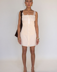 tan Woven coquette mini dress
Front bow detail
Front button closure
Adjustable lace and ribbon shoulder straps
Pintuck details on bodice
Smocked backing
Lined
summer mini dress
spring mini dress