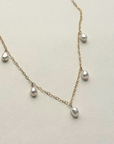 Gold filled pearl charm anklet
Length: 8” Chain with 1.5” extender
Charm: Five .25" pearls
Size and shape of pearls may vary