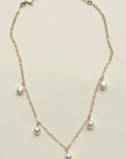Gold filled pearl charm anklet
Length: 8” Chain with 1.5” extender
Charm: Five .25" pearls
Size and shape of pearls may vary