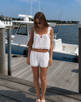 TOP
Woven cotton cropped tank top
Lace trim
Adjustable front tie
BOTTOM
Woven cotton mini shorts
Lace trim
Elastic adjustable waistband
white tank top and short set
cute lounge easywear