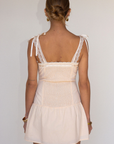 tan Woven coquette mini dress
Front bow detail
Front button closure
Adjustable lace and ribbon shoulder straps
Pintuck details on bodice
Smocked backing
Lined
summer mini dress
spring mini dress
