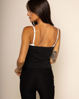 Peek-A-Boo corset tank top
Ruffle trim
Faux front buttons
Adjustable straps
Bra hook and eye closure
Side zipper closure
black and white corset top
going out tank top