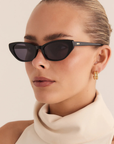 black Slimline cateye sunglasses
Soft, subtle lift through the frame
Acetate frame
Gold metal tip detailing
Polarised, scratch-resistant Category 3 lenses
100% UV protection
Width: 14.5cm / Lens Height: 3.85cm / Arm Length: 14.5cm / Nose Bridge: 2cm