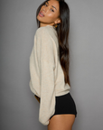 Fuzzy knit cardigan. Crewneck. Front button down closures. Long sleeves. Unlined. tan cardigan. fall cardigan. fall outfit. layering piece