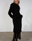 Black Faux sherpa longline coat. Faux fur collar neckline. Front snap button closure. Tie waist. Side pockets. Back slit. Fully lined. long coat. coat for new york. fall coat. fall outfit