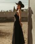 Woven maxi dress. Adjustable crisscross back straps. Back hook and eye and zipper closures. Fully lined. black maxi dress. country outfit. country dress. western outfit. western dress.