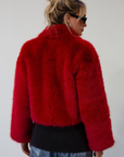 Faux fur coat. Collar neckline. Front zipper closure. Side pockets. Fully lined. red fur coat. fall coat. winter coat. red faux fur coat